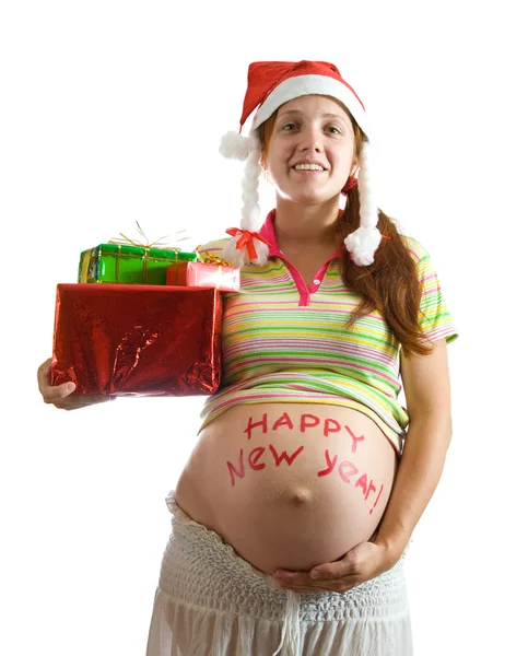 Беременная женщина с рождественскими подарками — стоковое фото