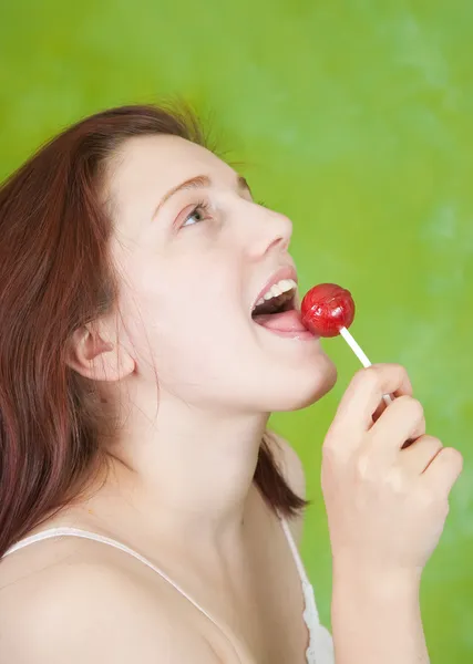 Sexy girl licking lollipop — Stock Photo, Image