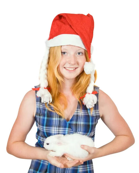 Flicka i santa mössa med kanin — Stockfoto