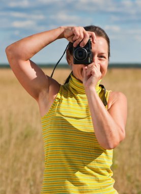 Woman taking photo with camera clipart