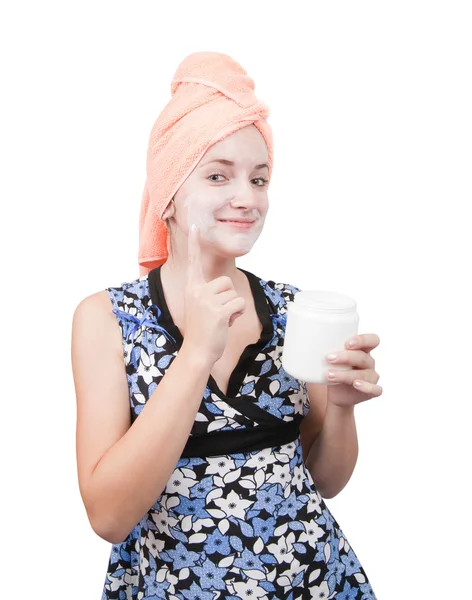 Giovane ragazza, fare confezioni di cosmetici. Isolato su bianco — Foto Stock