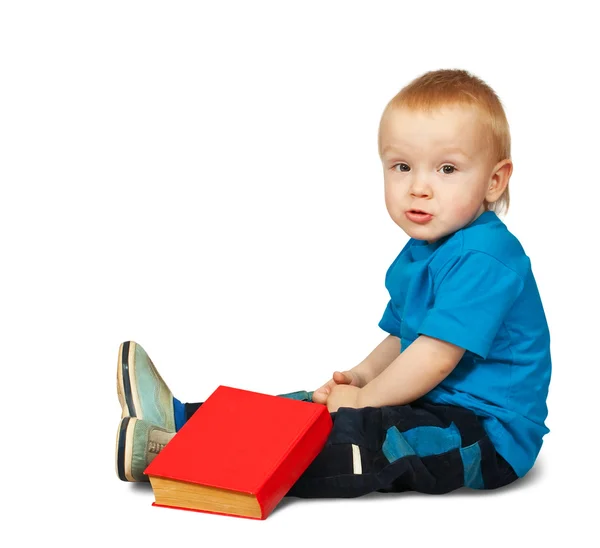 Pojke i blå tröja med bok — Stockfoto