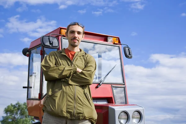 Farm worker with tractor — Stock Photo, Image
