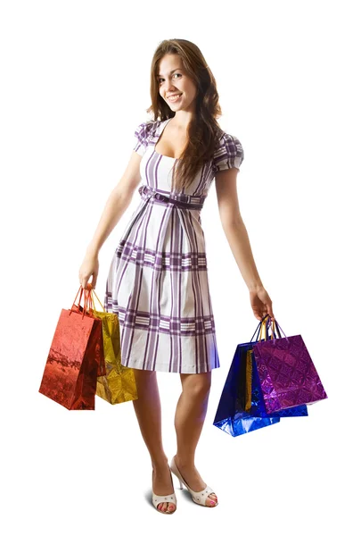 Flicka med shoppingväskor — Stockfoto