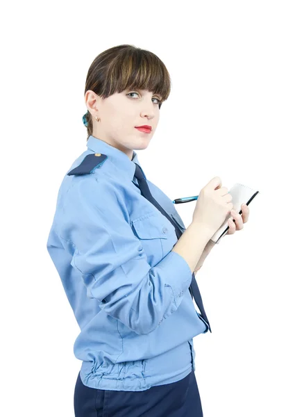 Femme en uniforme écrivant sur son bloc-notes — Photo