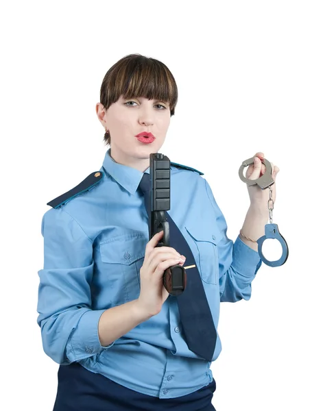 Žena v uniformě se zbraní a pouta — Stock fotografie