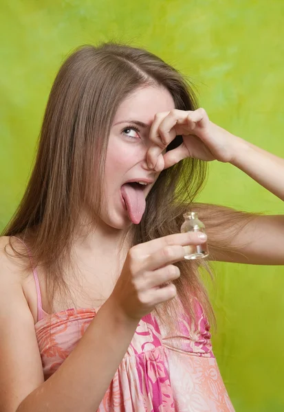 Girl holding her nose because of a bad smell — Stock Photo, Image