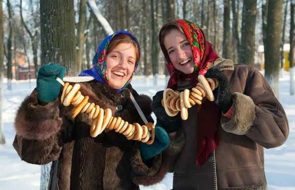 Smiling girls with round cracknel — Stock Photo, Image