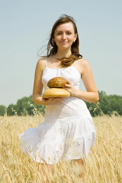 stock image Girl with bread at cereals field