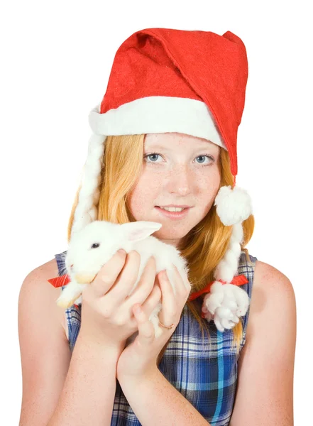 Teen in santa hat with rabbit — Stock Photo, Image