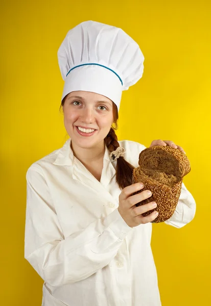 Baker is showing fresh bread — Stock Photo, Image
