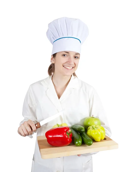 Cocinera femenina con verduras en tabla de cortar —  Fotos de Stock