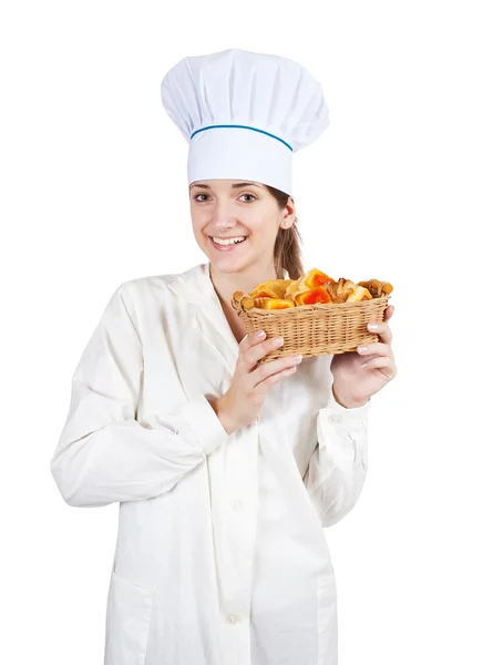 Cook woman in toque with pastry — Stock Photo, Image
