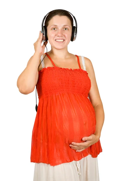 Kobieta w ciąży, słuchanie muzyki — Zdjęcie stockowe