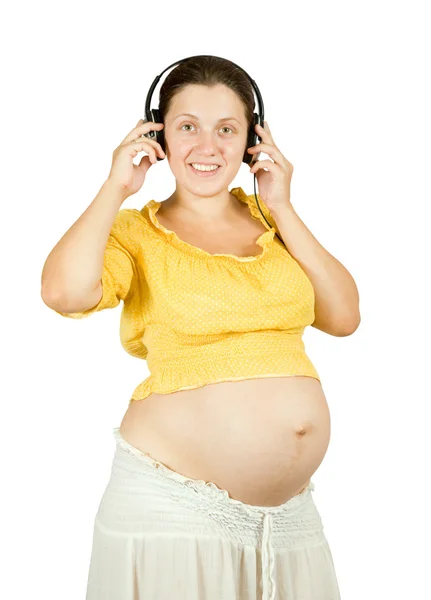 带耳机的孕妇 — 图库照片