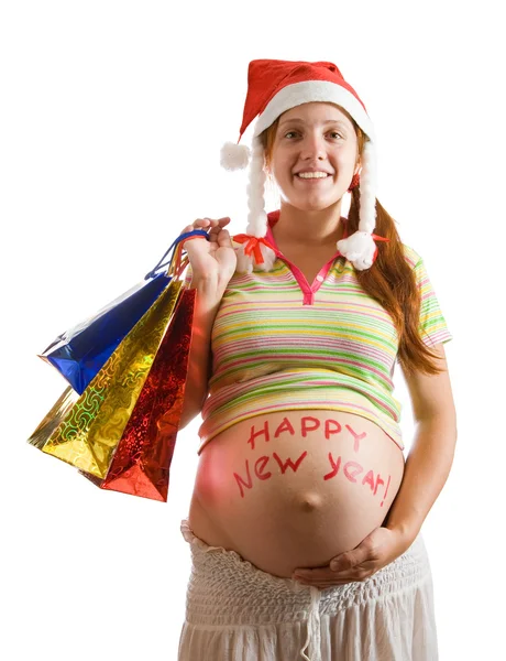 Elinde alışveriş torbaları olan hamile bir kadın. — Stok fotoğraf