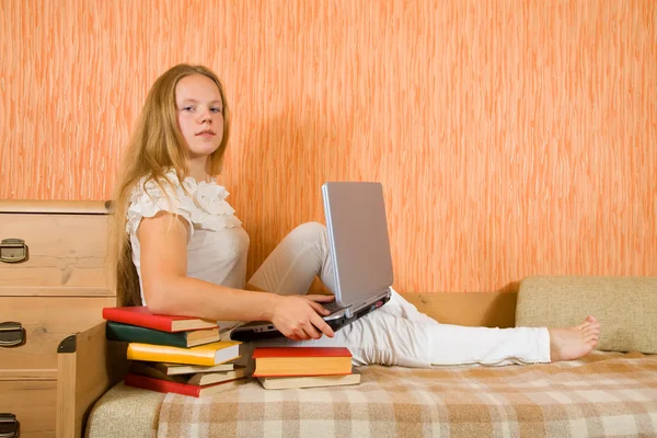 Girl with laptop and books — Stock Photo, Image