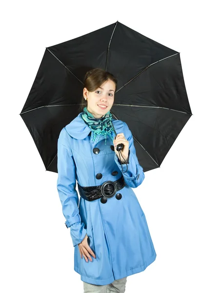 Frau im Regenmantel mit Regenschirm — Stockfoto