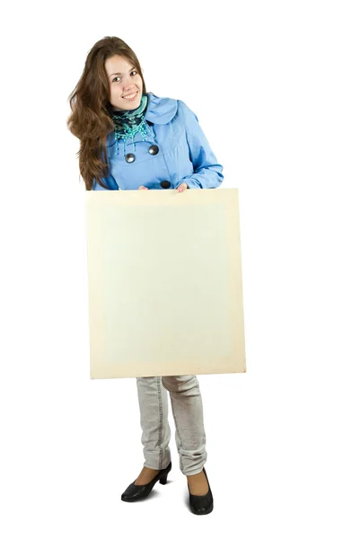 Dívka drží prázdné plátno. — Stock fotografie