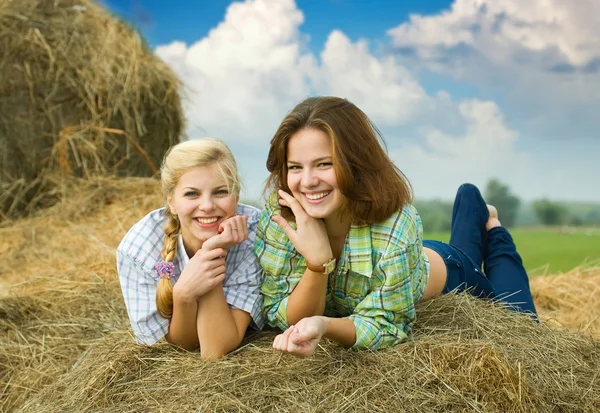 Girls on hay — Stock Photo, Image