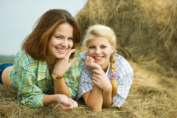 Pretty girls on hay — Stock Photo, Image