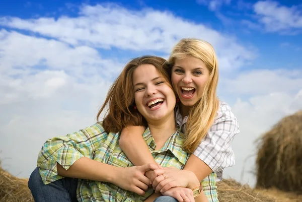 Happy girls at field — Stock Photo, Image