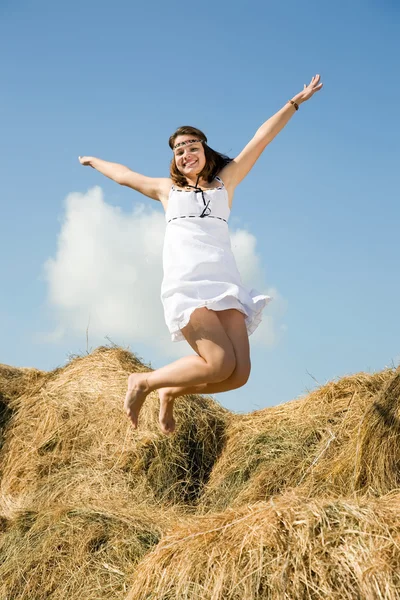 Jumping country girl — Stock Photo, Image