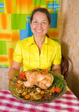Woman with cooked chicken clipart