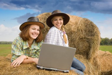 Two country girls with notebook clipart