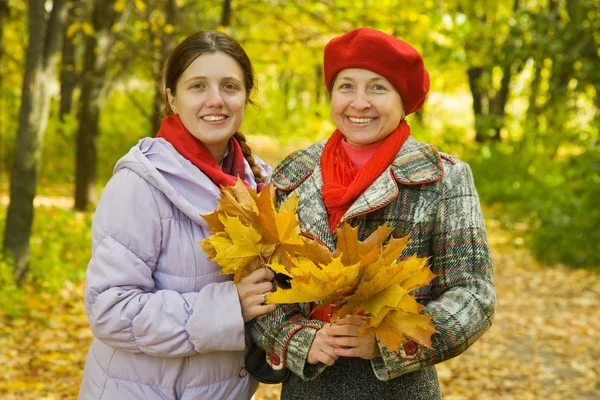 Mother with adult daughter in autumn — Stock Photo, Image