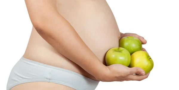 Беременная женщина с яблоками — стоковое фото