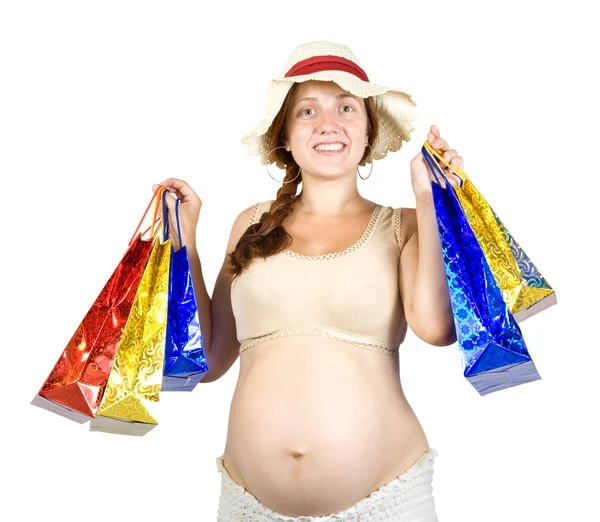 Femme enceinte avec sacs à provisions — Photo