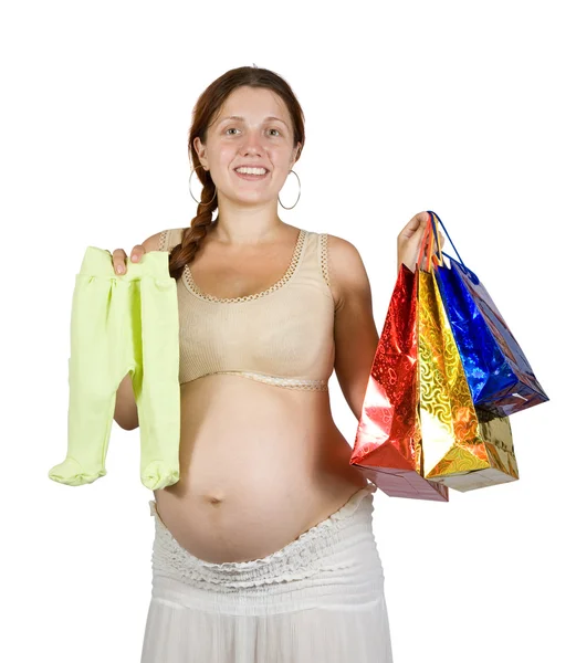 Έγκυος γυναίκα με ρούχα του μωρού — Φωτογραφία Αρχείου