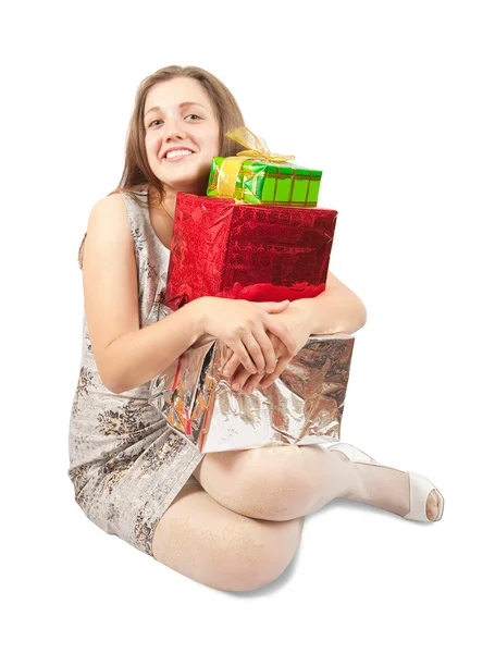 Dívka s několika barevnými dárky — Stock fotografie