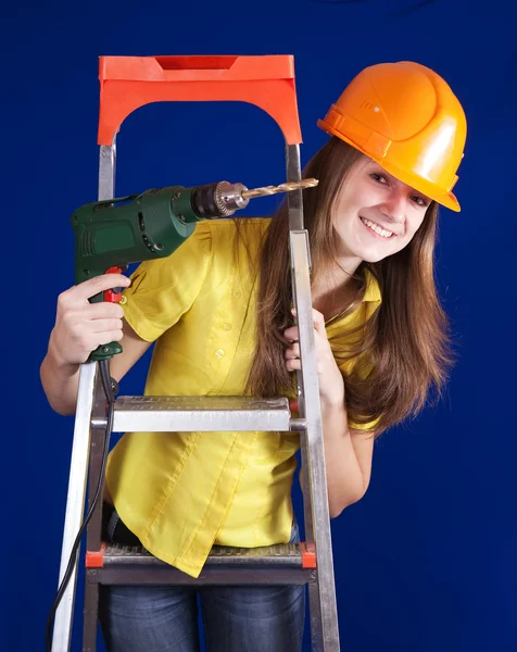 Vrouwelijke bouwvakker met boor — Stockfoto