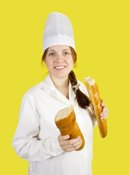 Baker is showing French long baton — Stock Photo, Image