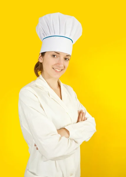Cozinheiro Fêmea Toque Sobre Fundo Amarelo — Fotografia de Stock