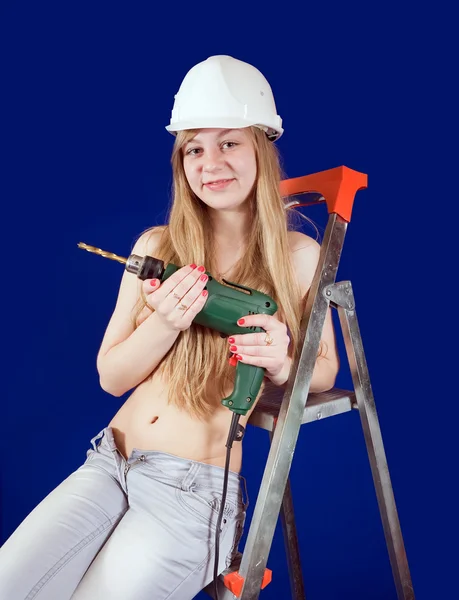 Sexy girl in hard hat with drill — Stock Photo, Image