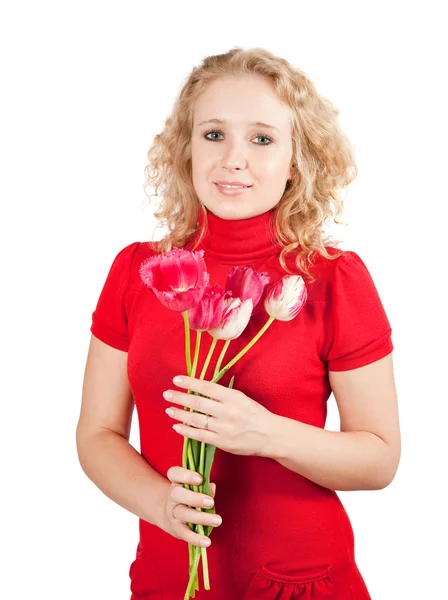 Gekrulde meisje met tulpen — Stockfoto