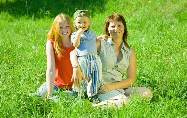 Happy Mother Her Children Sit Grass — Stock Photo, Image