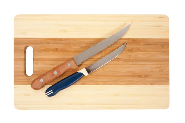 Knivar över skärbräda — Stockfoto