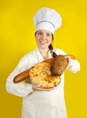 Female baker with hands full of bread over yellow clipart