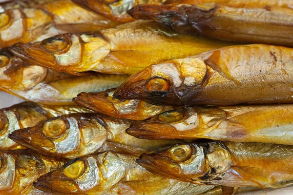 stock image Background of golden smoke-dried fish close up