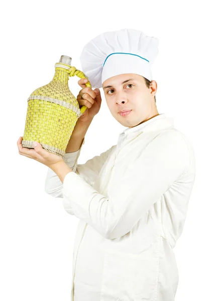 Chef holding large bottle — Stock Photo, Image
