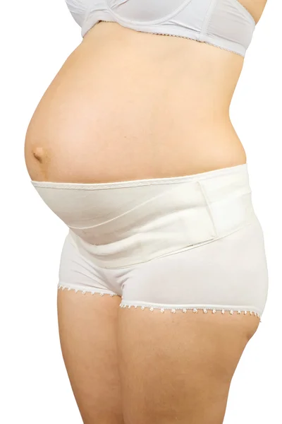 Hamile kadın giyiyor obstetrik binde — Stok fotoğraf