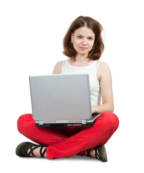 年轻的女孩坐在一起的笔记本电脑 白上孤立 — 图库照片