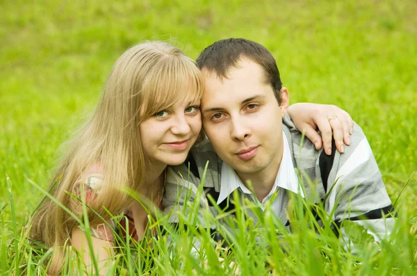 Couple resting on grass Stock Picture