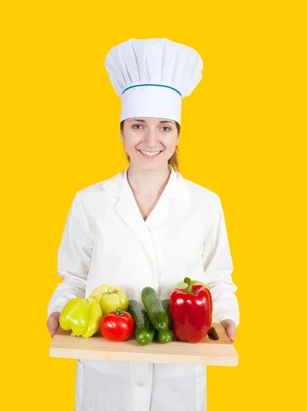 Vrouwelijke kok met groenten — Stockfoto