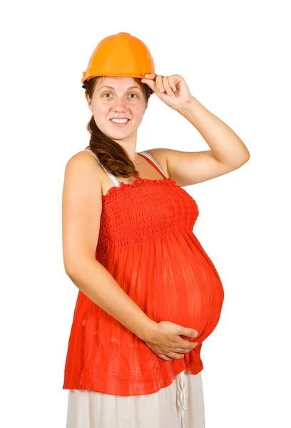 Těhotná žena v bezpečnostní přilba — Stock fotografie