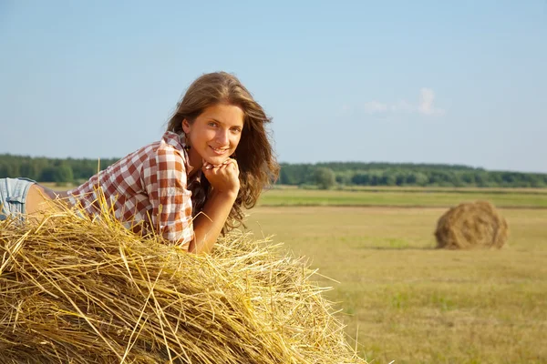 Girl enjoying on hay — Stock Photo, Image